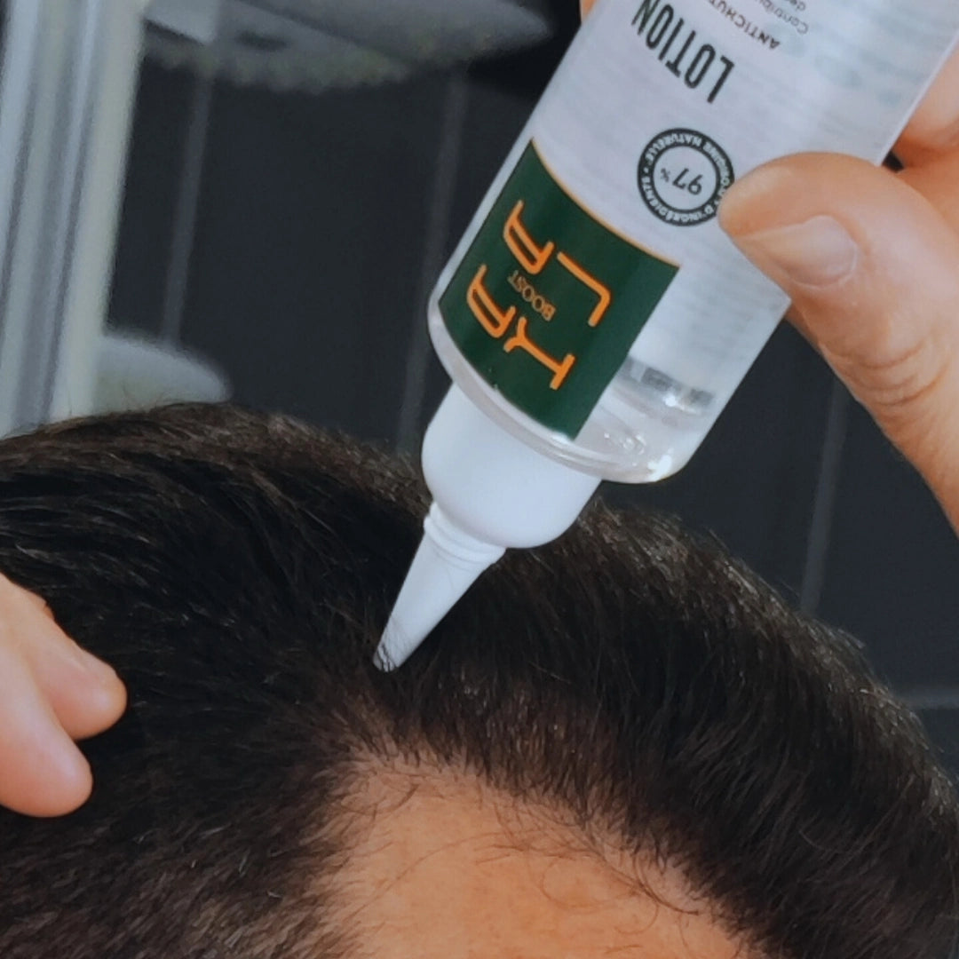 application de la lotion anti chute kalaboost après le shampoing 